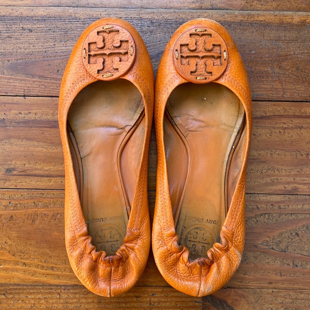 Orange Tory Burch Flats, worn over the last few years! Some  marks (see photos)